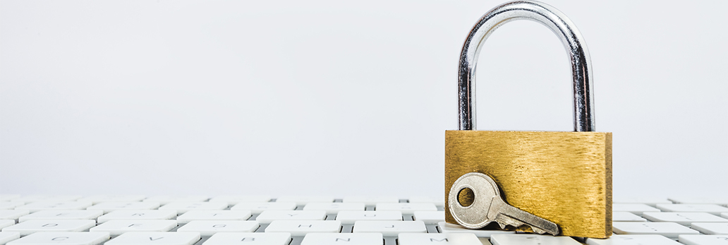 A padlock sits on a keyboard