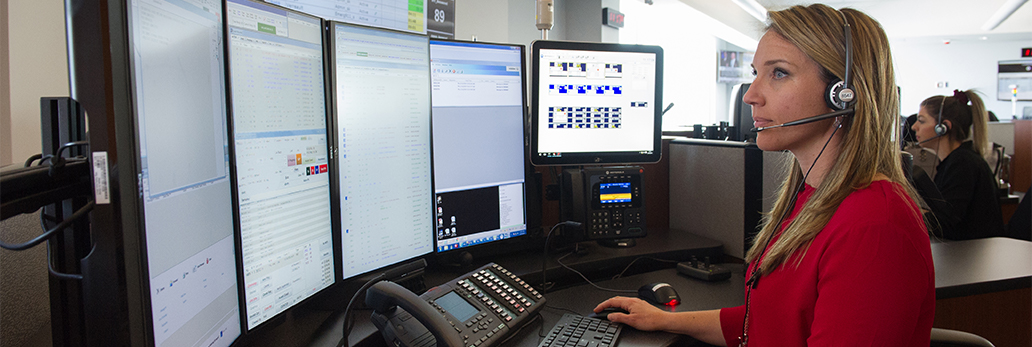 Halton Police call taker looking at computer screens