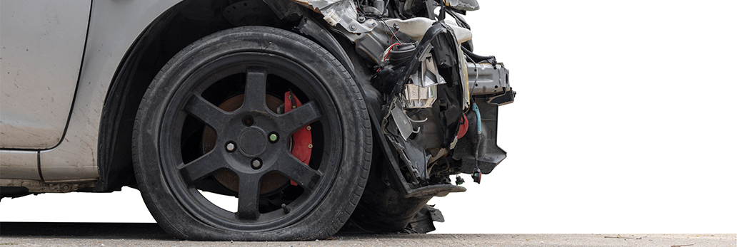 Damaged front end of a grey vehicle