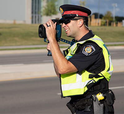 Male HRPS officer conducts speed enforcement