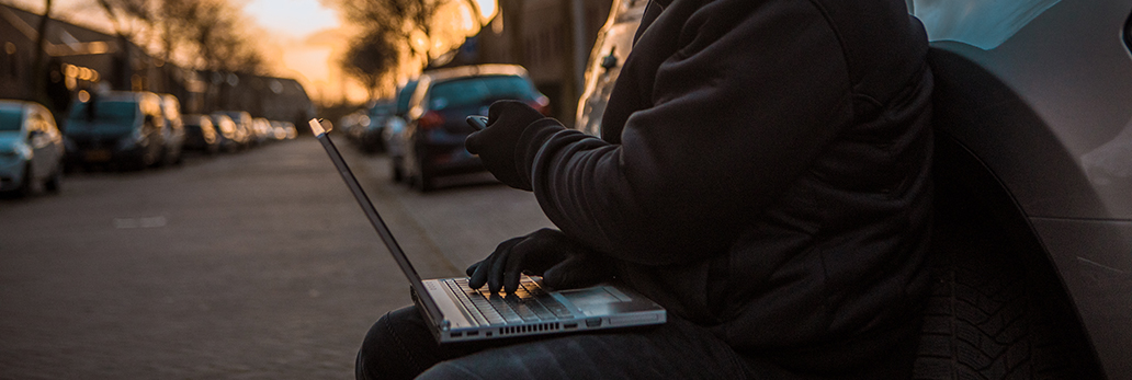 Male reprogramming a vehicle key fob.