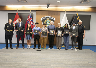 The 2025 Impact Award winners with Deputy Chief Hill and Inspector Dickson