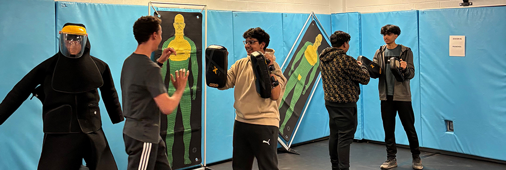 Youth participating in one of the PEACE nights in our Defensive Tactics Room