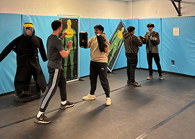 Youth participating in one of the PEACE nights in our Defensive Tactics Room