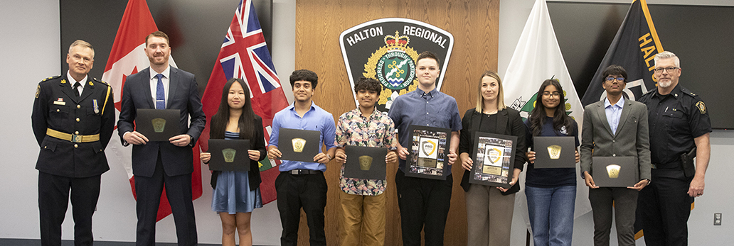 The 2025 Impact Award winners with Deputy Chief Hill and Inspector Dickson