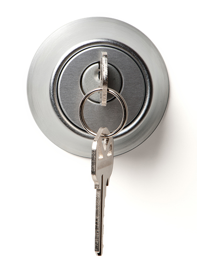 Close-up of a key in a deadbolt lock