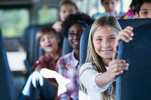 Children seated inside a school bus