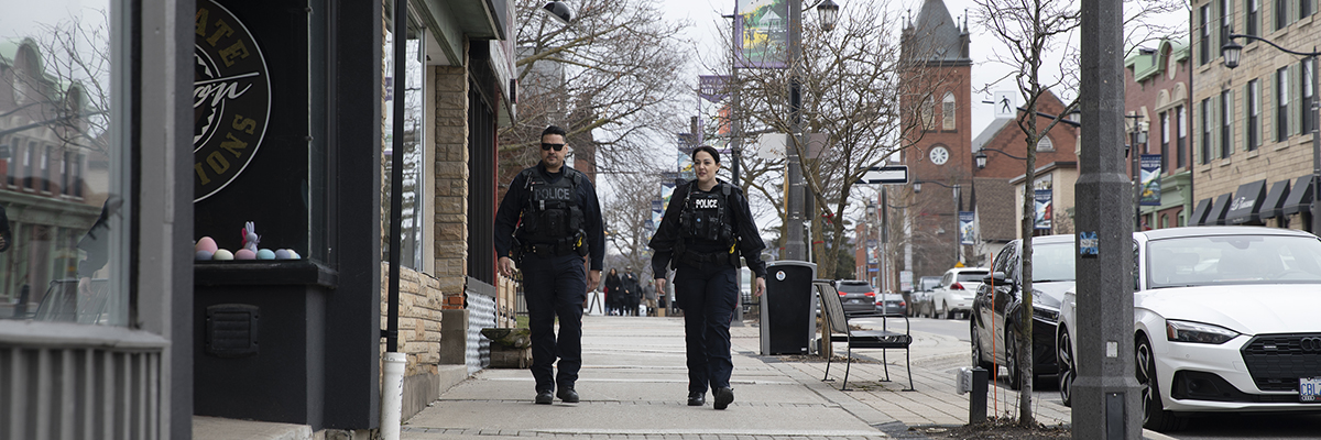 Officers walking down the street in Milton