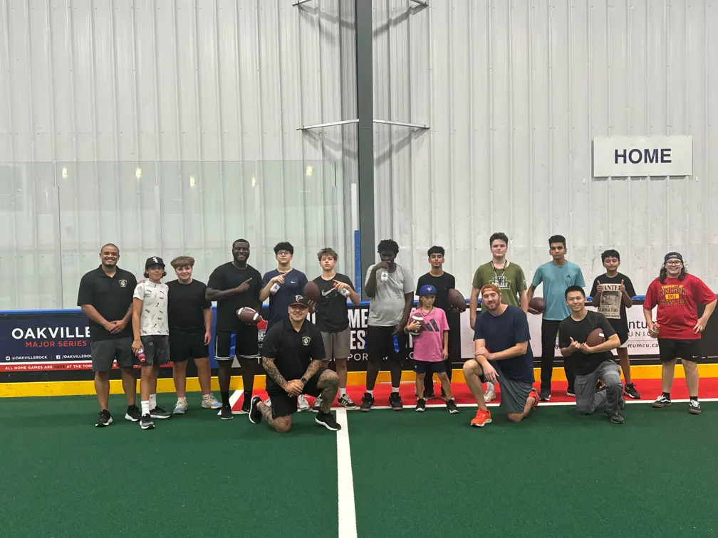 Officers with youths playing football
