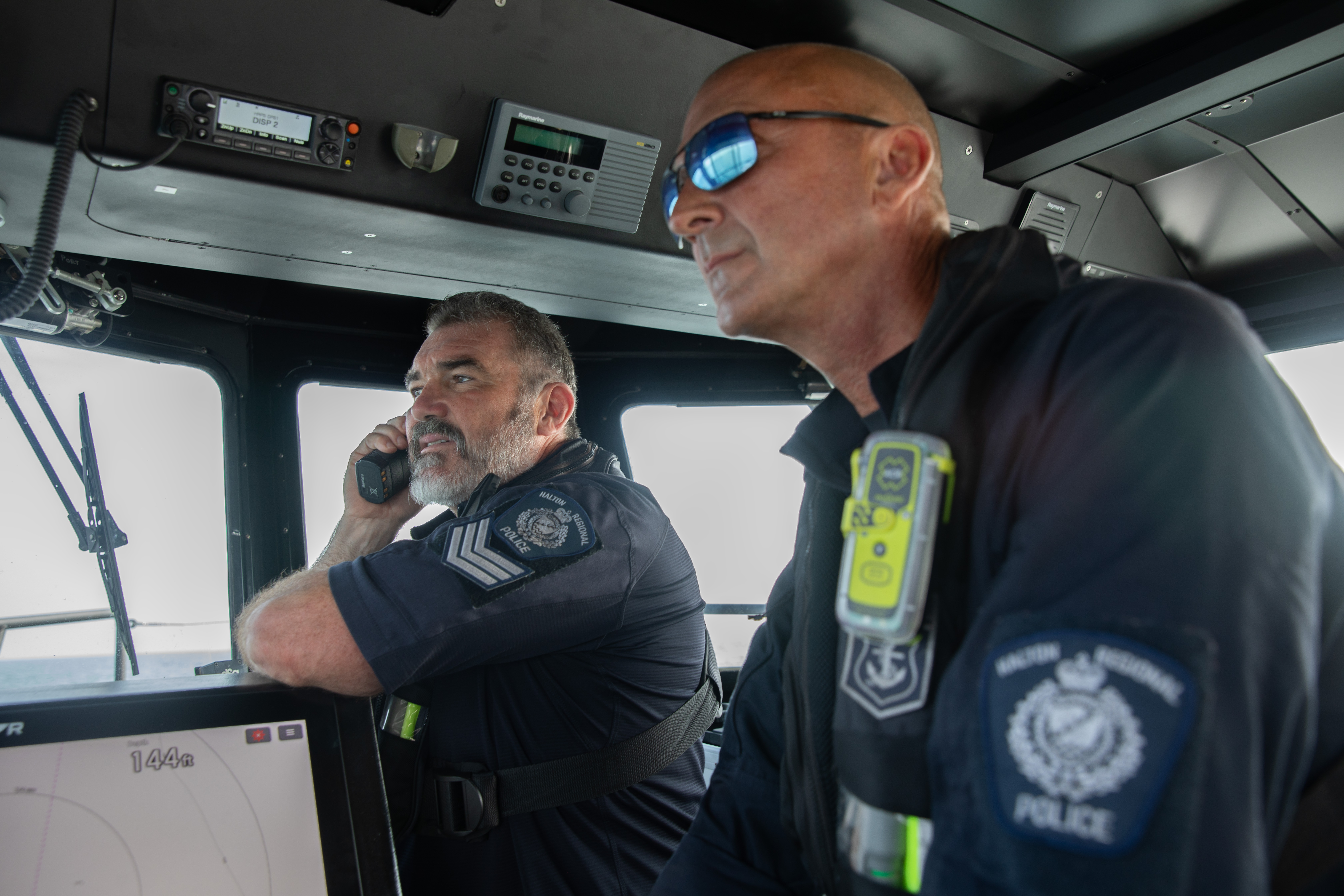 Marine officers on the radio in the Marine 1 boat